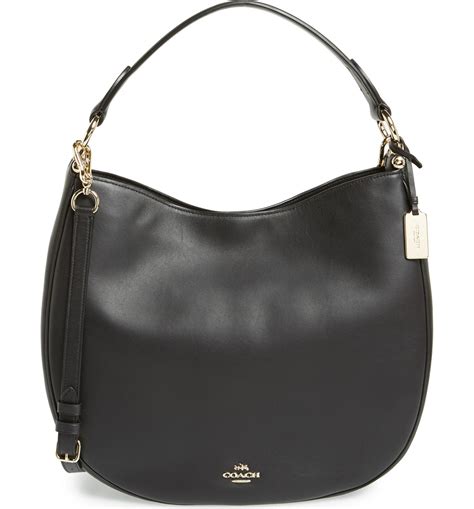 Capture the beauty of American style with a <strong>black COACH purse</strong>. . Coach hobo handbags